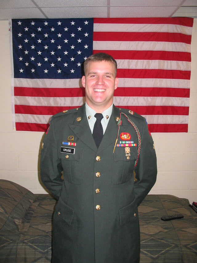 Chris in dress greens while in barracks room